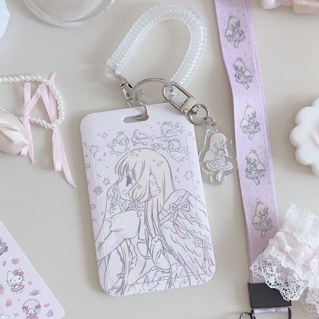Chobits Chii card holder set – front view showing embossed angel illustration with coil strap and acrylic charm