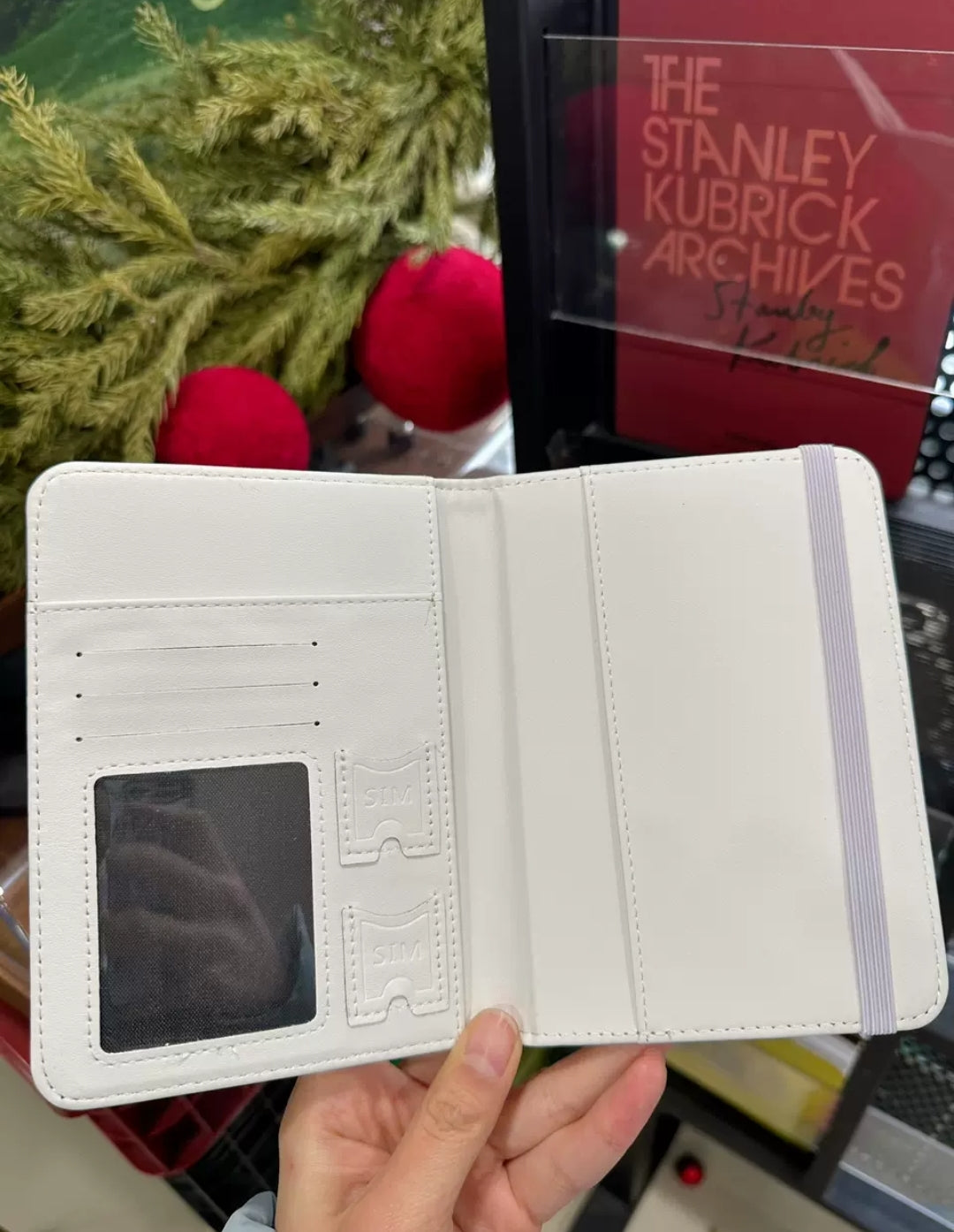 ACCIO x Niaoniaoy girl snow globe passport holder - open interior showing elastic passport pocket