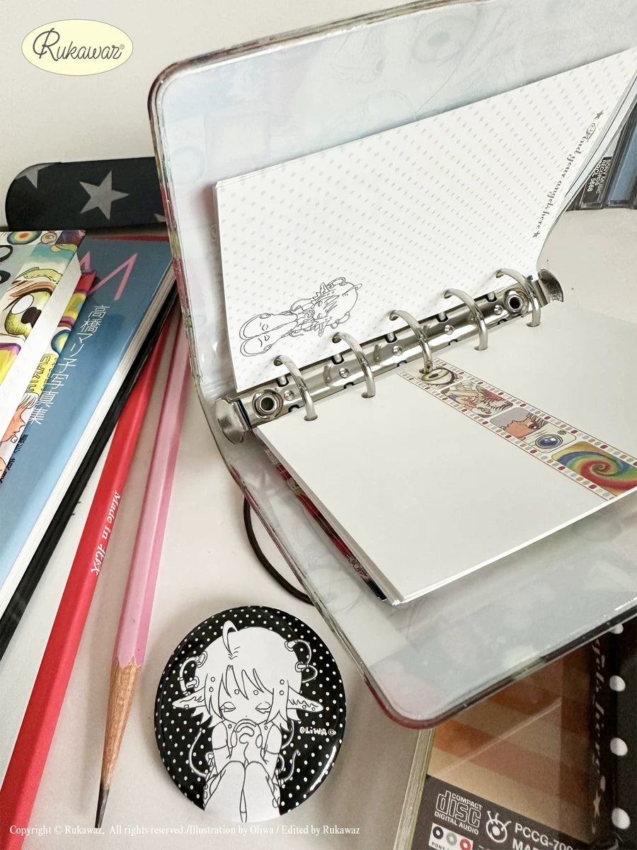 Rukawaz x Oliwa Final Angel M5 binder - open interior with dot-grid pages and round badge
