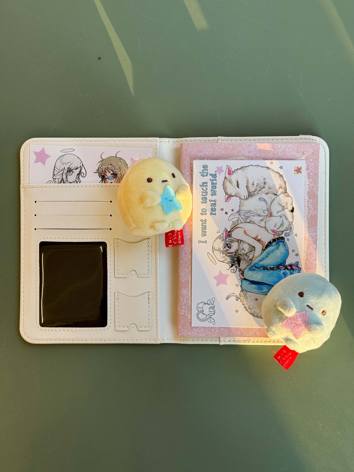 Oliwa original manga passport holder - interior card slots and illustration detail with plush charms