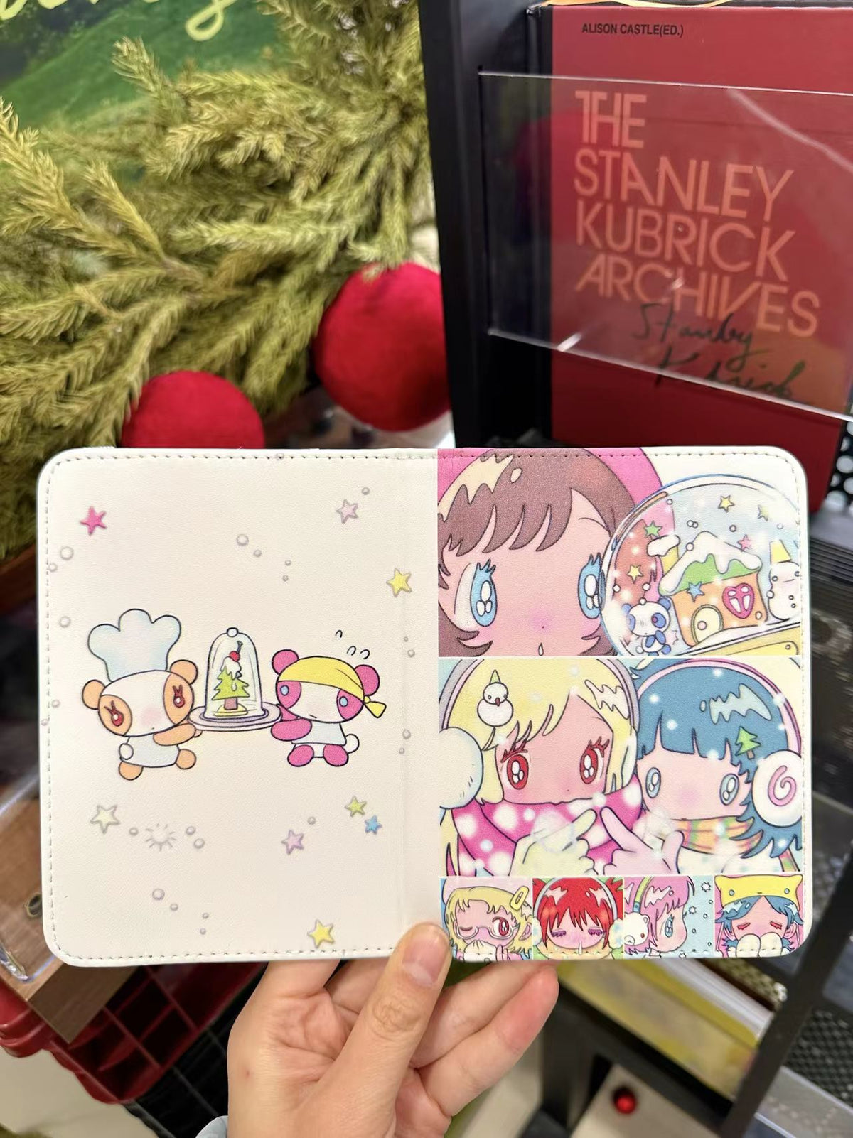 ACCIO x Niaoniaoy girl snow globe passport holder - open interior showing card slots and illustration lining