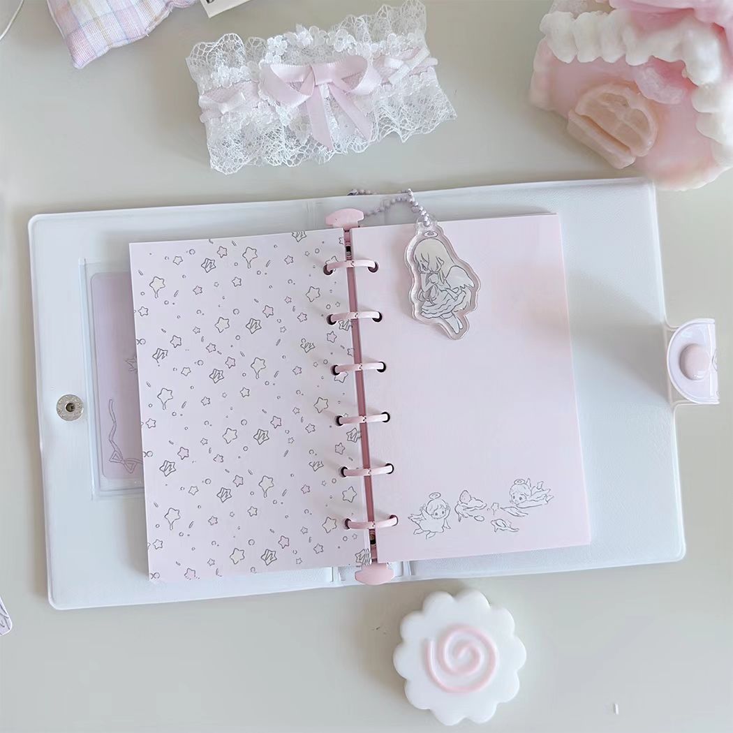 Chobits Chii kawaii loose-leaf journal – open view showing starry inner pages and pink ring binding