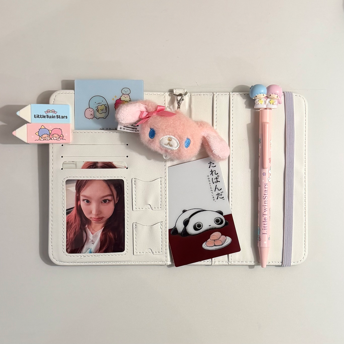 onionion angel girl passport holder flat lay with accessories