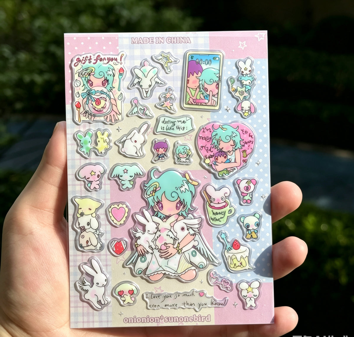 Dating me is like this puffy sticker sheet held in hand showing holographic finish